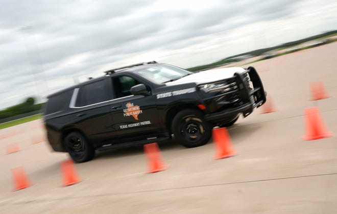 A Department of Public Safety trooper competes in the driving skills contest at the 12th Annual Top Trooper Competition at the DPS Tactical Training Center in Florence Tuesday April 23, 2024. The weeklong event has 120 troopers competing in physical fitness, driving and firearms skills, and job knowledge. The male and female winners will earn the Javier Arana, Jr. Top Trooper Award, named after fallen Trooper Javier Arana, Jr., who participated in the inaugural competition, and get a new patrol vehicle.