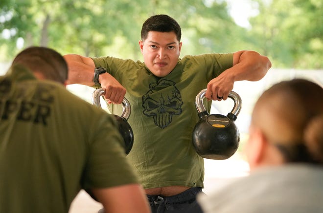 Department of Public Safety Trooper Jerardo Tapia competes in the physical fitness contest at the 12th Annual Top Trooper Competition at the DPS Tactical Training Center in Florence Tuesday April 23, 2024. The weeklong event has 120 troopers competing in physical fitness, driving and firearms skills, and job knowledge. The male and female winners will earn the Javier Arana, Jr. Top Trooper Award, named after fallen Trooper Javier Arana, Jr., who participated in the inaugural competition, and get a new patrol vehicle.